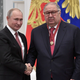 Putin shakes hands with Usmanov during an awarding ceremony at the Kremlin in Moscow, Russia November 2018.